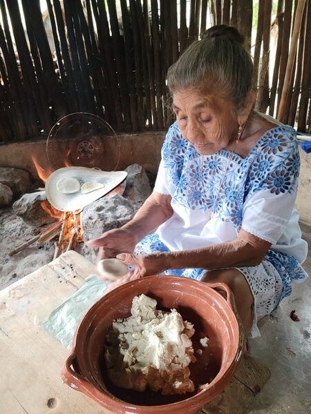 Tortilla making in the Yucatan Yucatecan woman making tortillas, Mexico