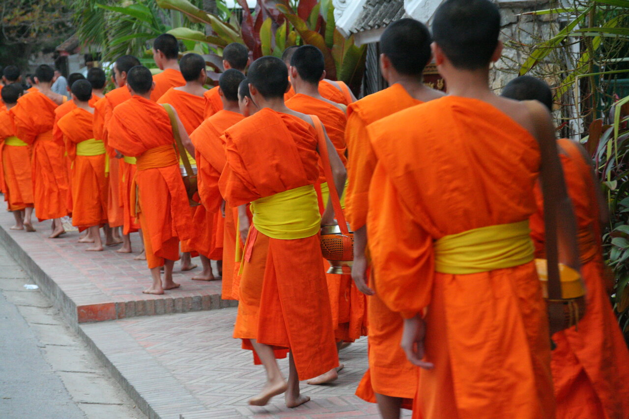 Monks Seeking Alms Luang Prabang Saffron colored monks in Luang Prabang, Laos