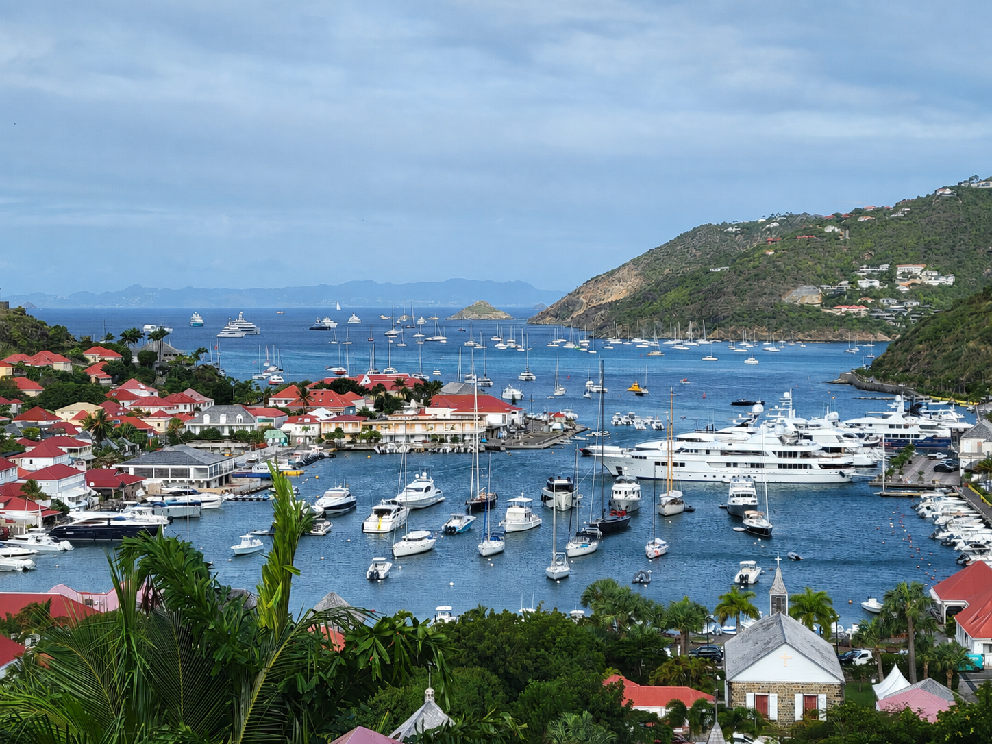 Gustavia Harbor from Above Gustavia St Barthelemy harbor with boats, rooftops and ocean